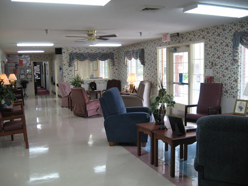 A comfortable community lounge area with seating and natural light.