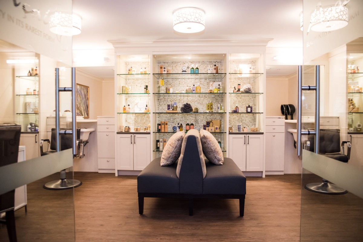 A modern interior with stylish shelving and seating.