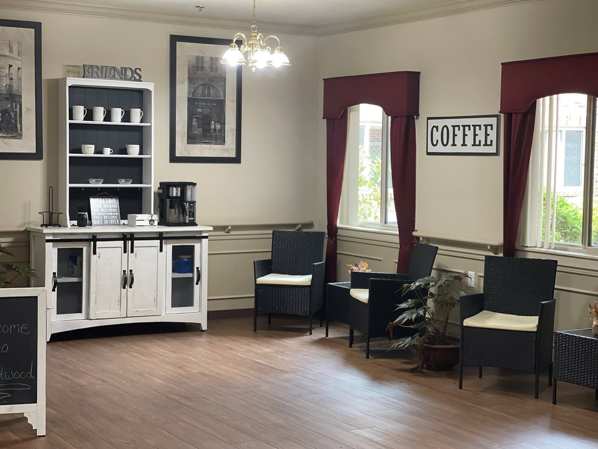 A cozy waiting area with a coffee station and comfortable seating.