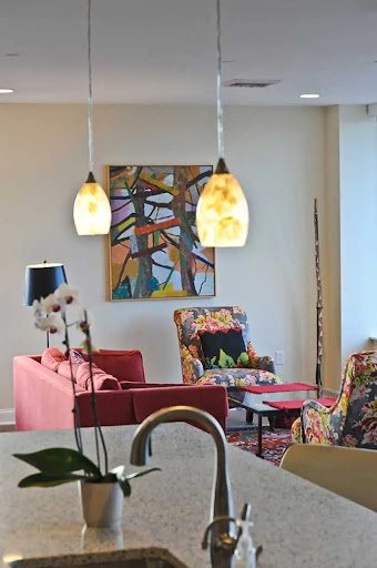 A vibrant living room featuring colorful furniture and modern art pieces.