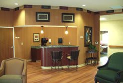 A cozy reception area with a counter and seating.