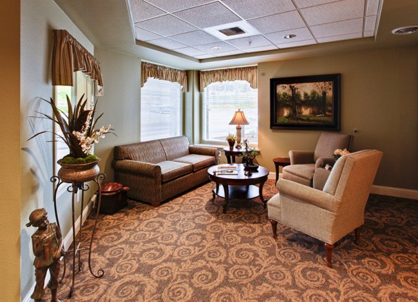 A cozy living room with comfortable seating and elegant decor.