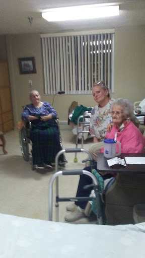 A moment of connection and care in a senior living facility.