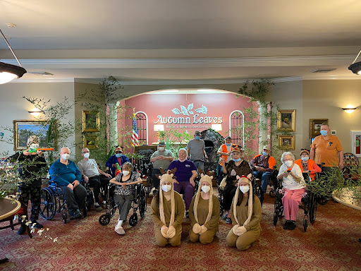 A joyful gathering at a community event where seniors enjoy an entertaining performance.