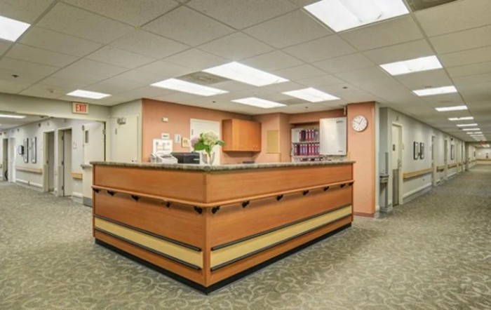 A reception desk area with warm lighting and a welcoming atmosphere.