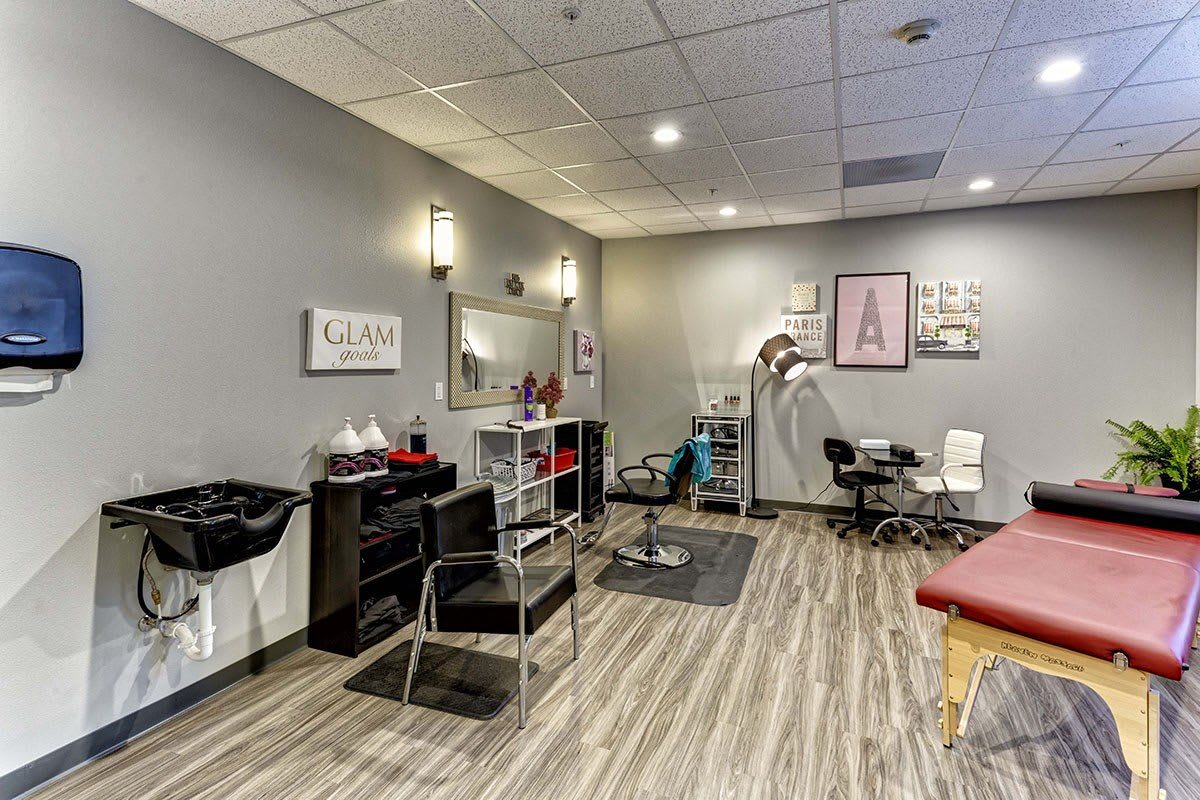 A modern salon interior featuring hair styling chairs, mirrors, and professional equipment.