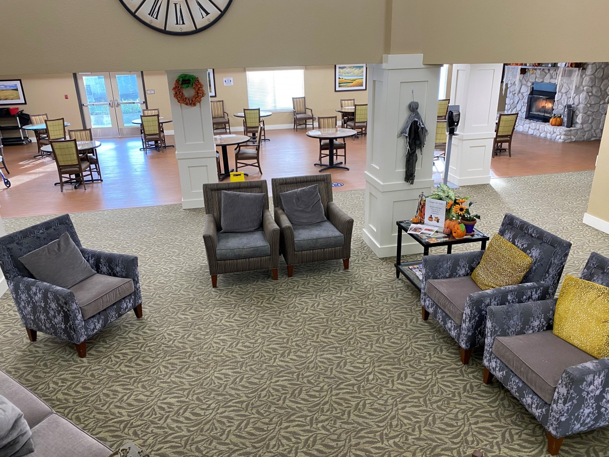 A spacious living area with comfortable seating and decor.