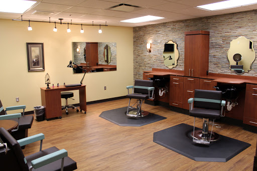 A modern hair salon equipped with stylish chairs and a warm ambiance.