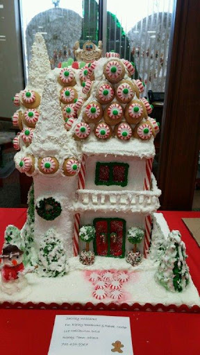 A beautifully decorated gingerbread house adorned with festive candies, perfect for the holiday season.