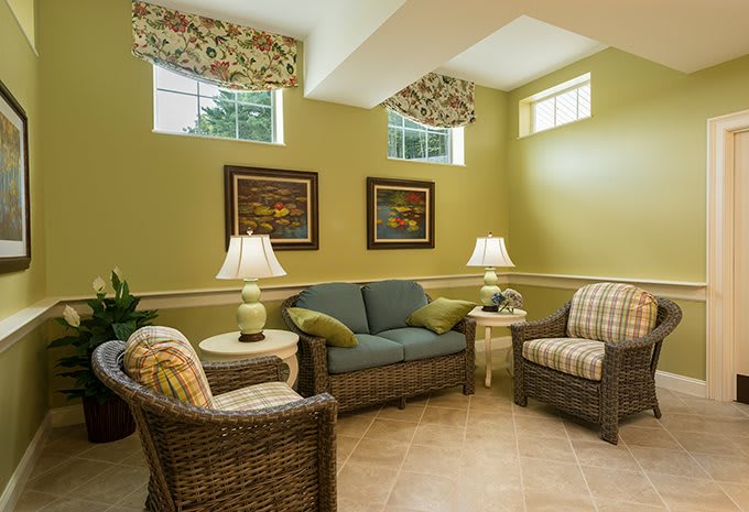 A cozy living room with wicker furniture and warm lighting.