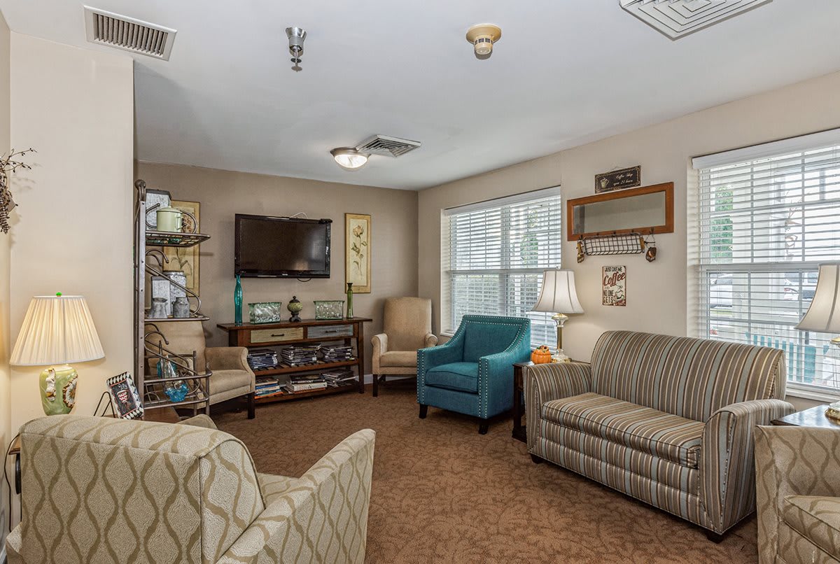 A cozy living room with comfortable seating and a TV.
