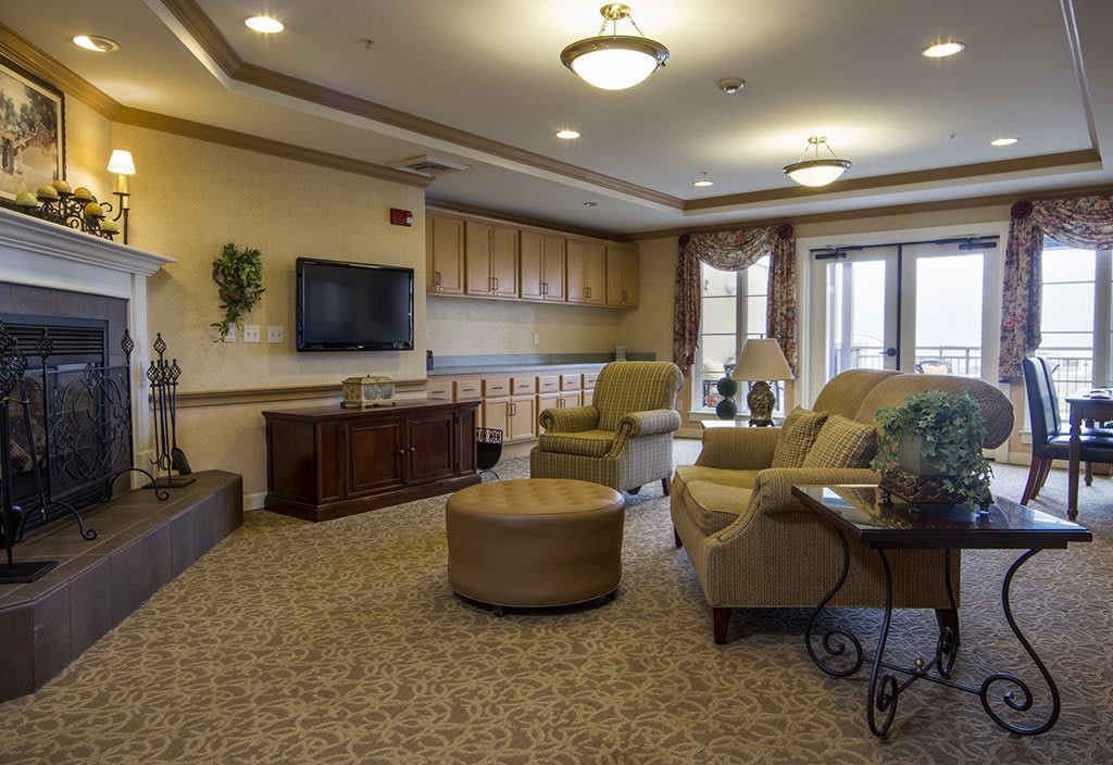 A cozy living room with comfortable seating and a television.