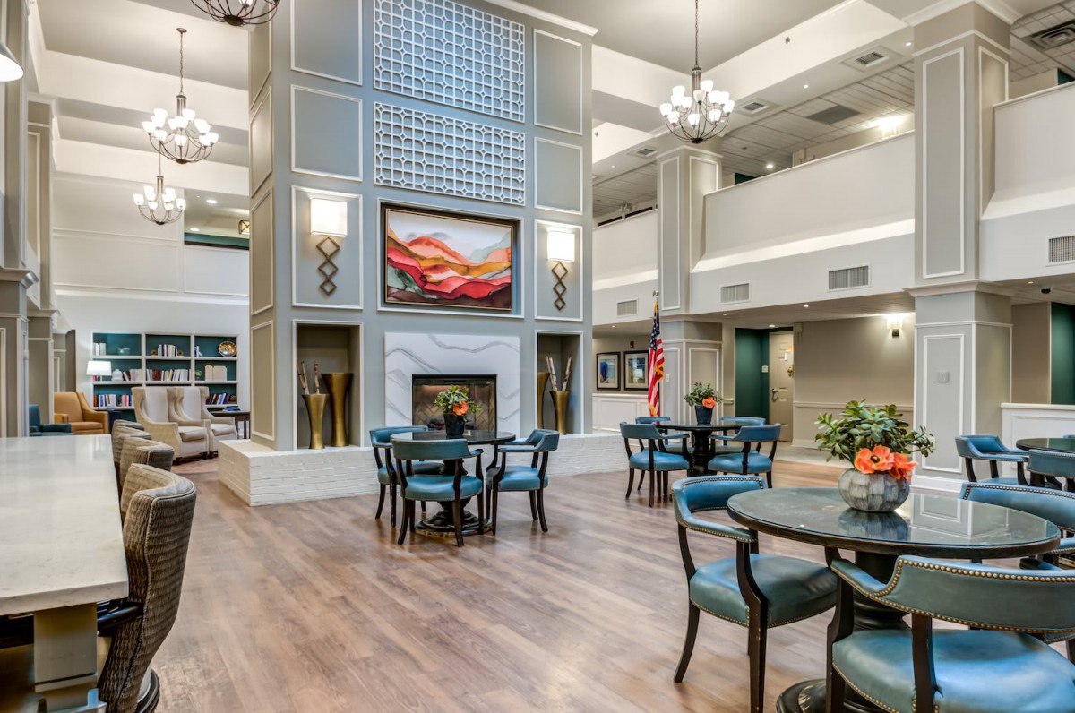 Spacious and elegant lobby with a cozy fireplace and comfortable seating.