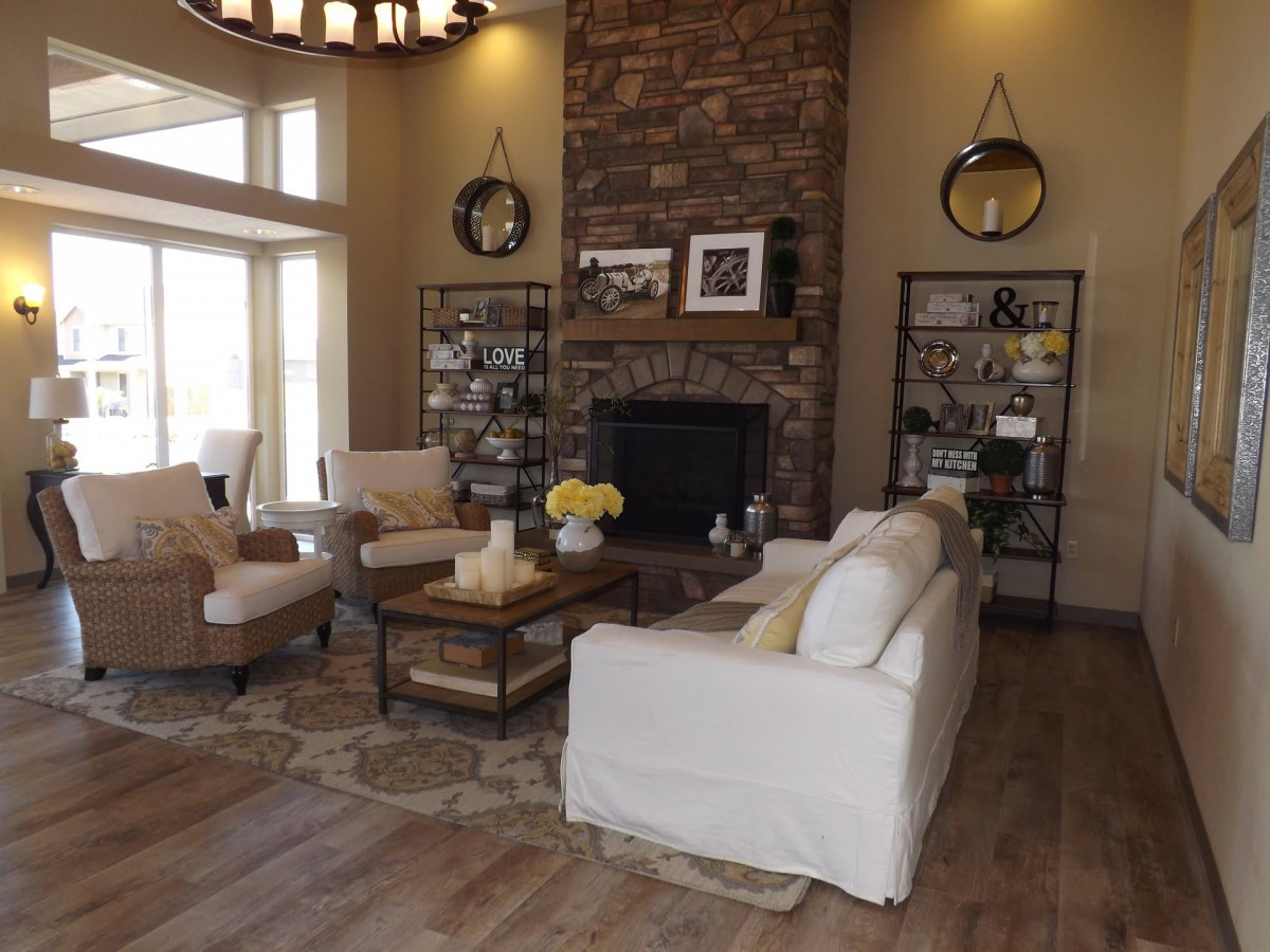 A cozy living room with a fireplace, comfortable seating, and elegant decor.