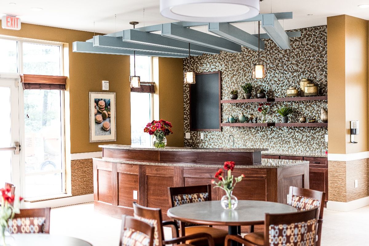 A cozy bar interior with elegant decor and furnishings.