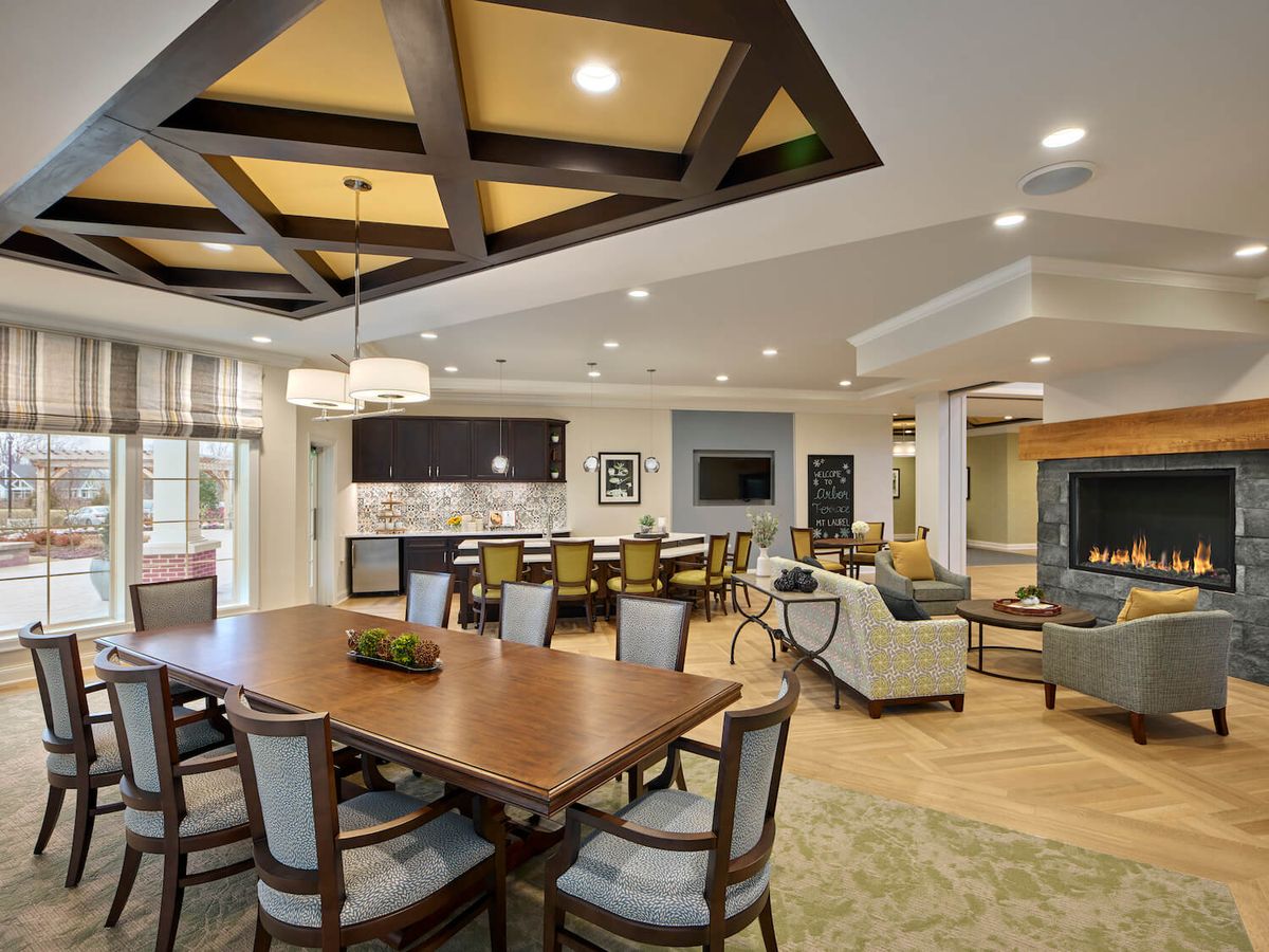 A modern open-concept dining and living area with stylish furnishings and a well-lit interior.