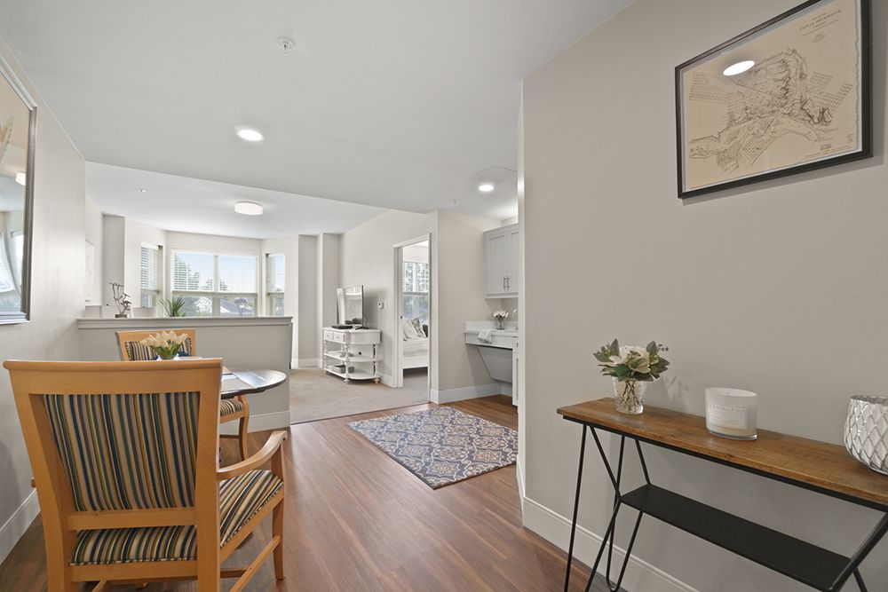 A modern living room with elegant decor and wooden flooring.