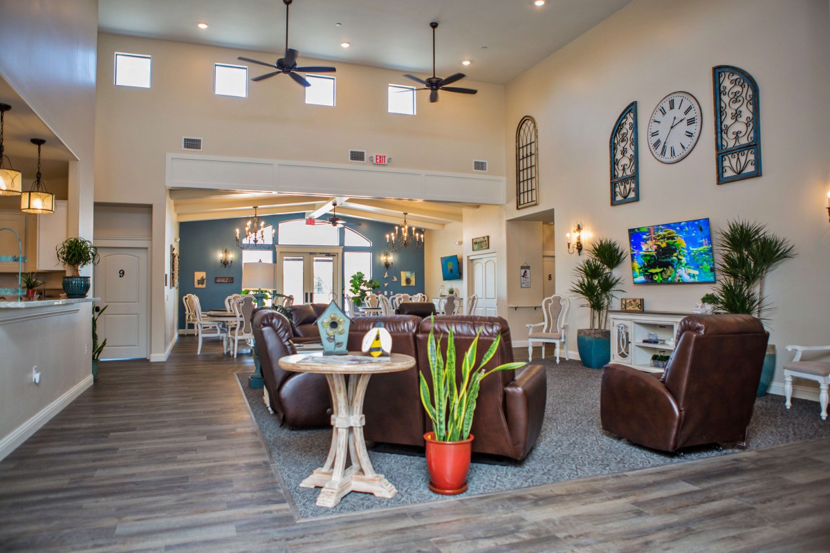 A modern living room interior with comfortable seating, stylish decor, and a warm atmosphere.