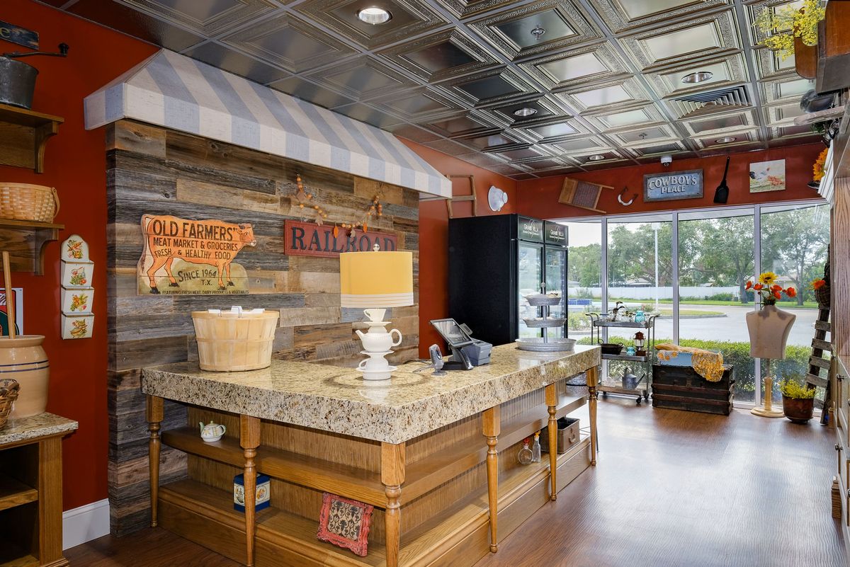 A rustic-themed restaurant interior featuring a wooden counter and various decorations.