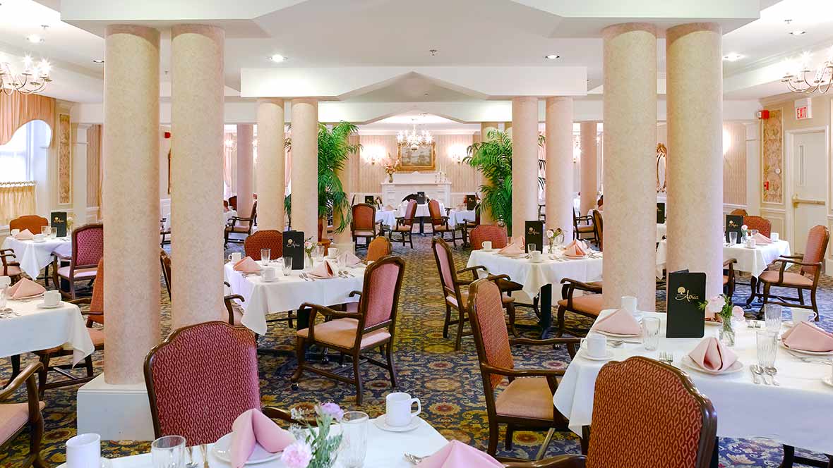 An elegant restaurant dining area with neatly arranged tables and chairs.
