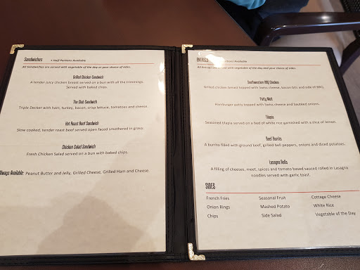 A menu displayed at a restaurant, featuring various food and beverage options.