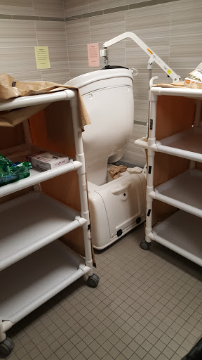 A glimpse into a hospital storage area showcasing medical equipment and carts.