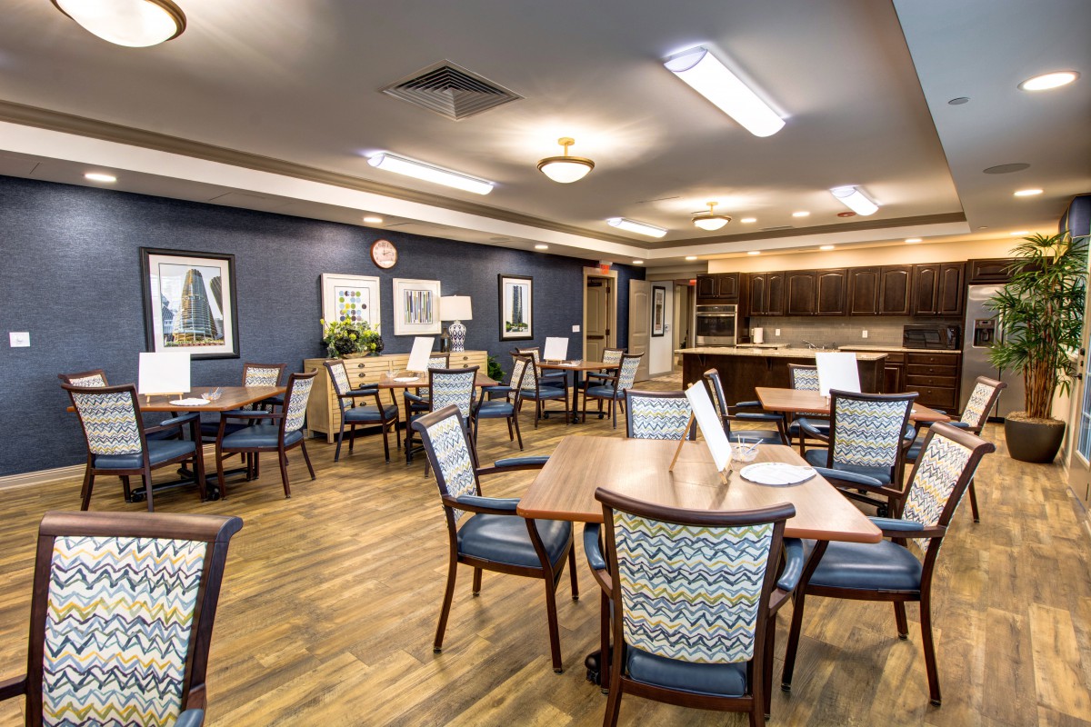 A well-decorated dining area with tables and chairs arranged neatly.