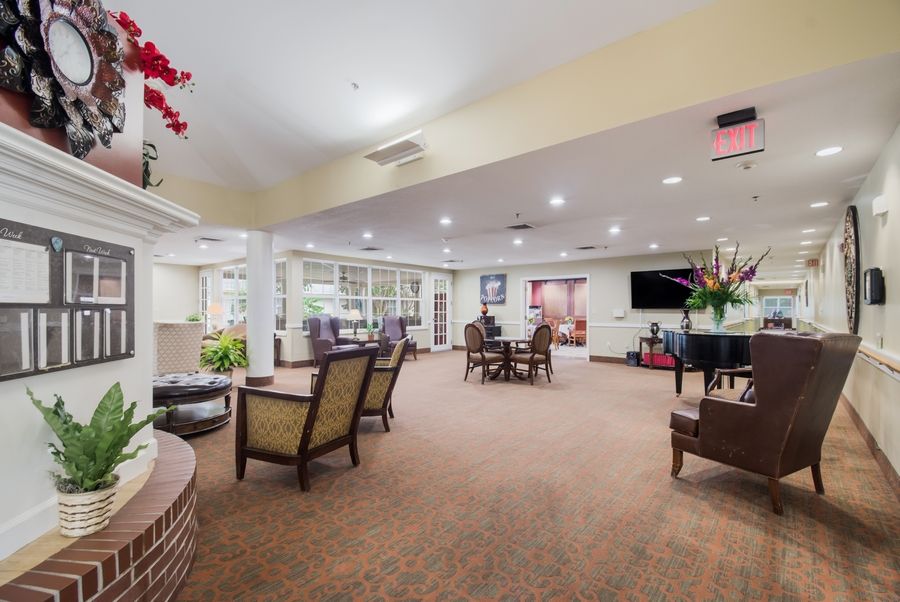 A spacious and well-lit lounge with comfortable seating and elegant decor.