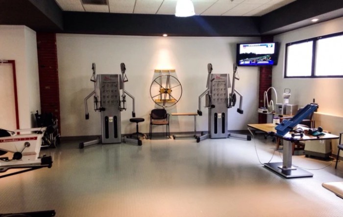 A gym area featuring exercise machines designed for strength training.