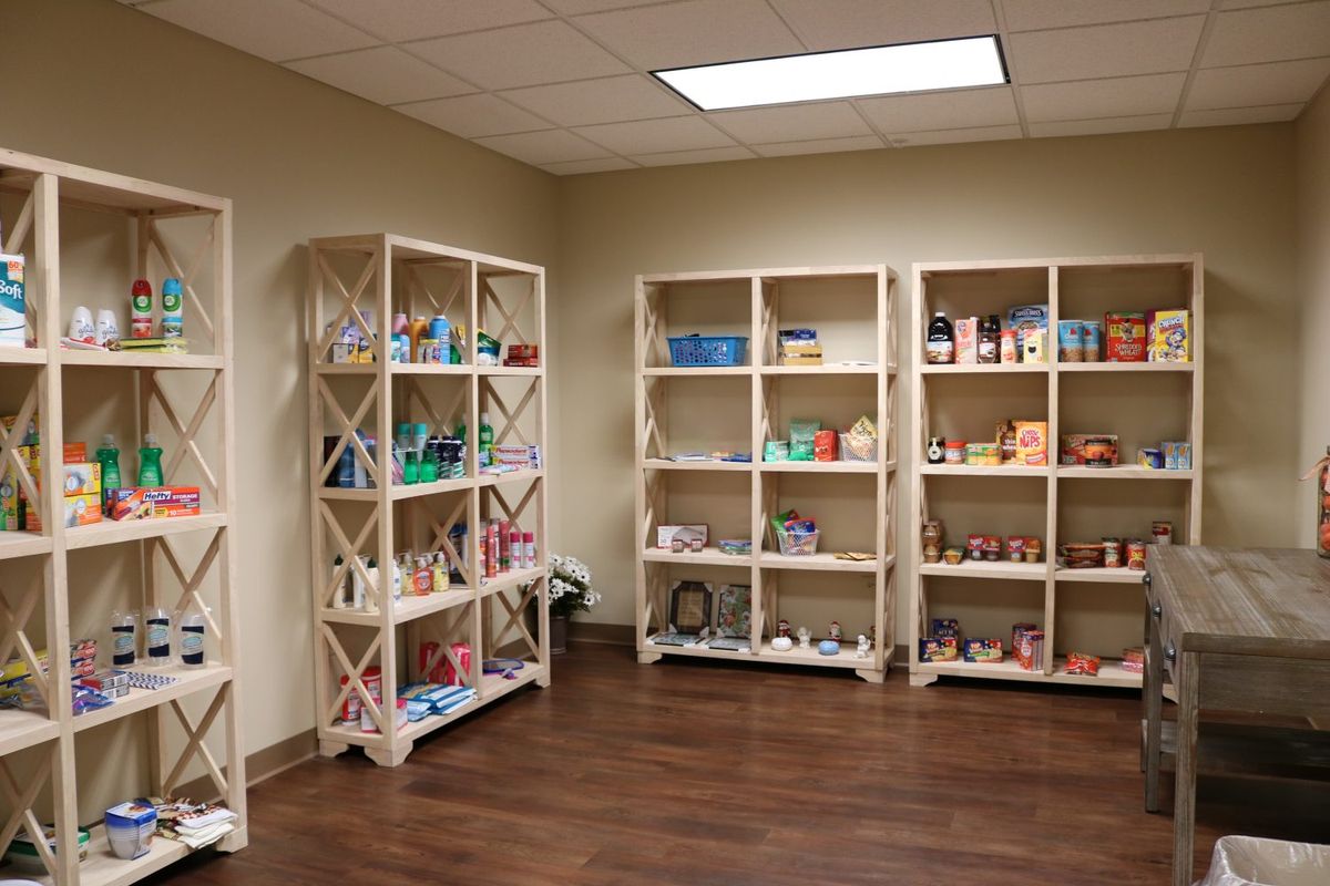 A well-organized playroom with shelves filled with various toys.