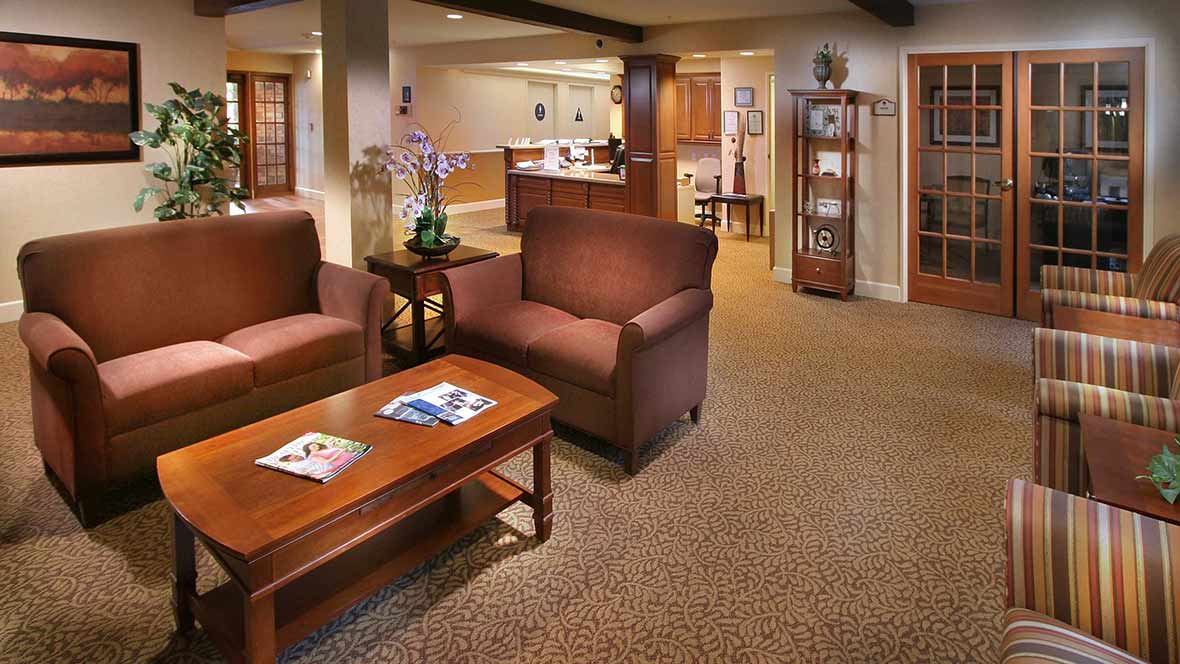 A cozy lobby with comfortable seating and warm lighting.