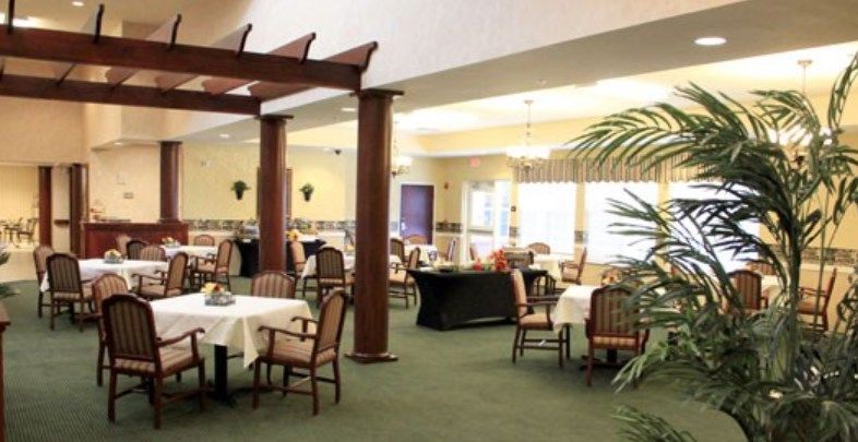 A spacious restaurant dining area with neatly arranged tables and chairs.