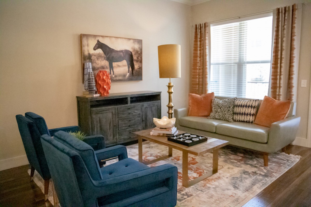 A cozy living room with stylish furniture and artwork.