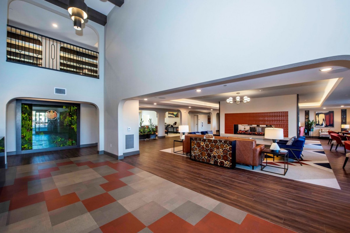 Modern lobby with a spacious seating area and stylish decor.
