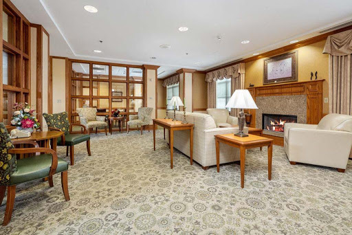 A cozy living room with comfortable seating and warm lighting.