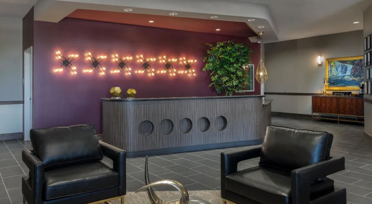 A modern reception area with stylish lighting and comfortable seating.