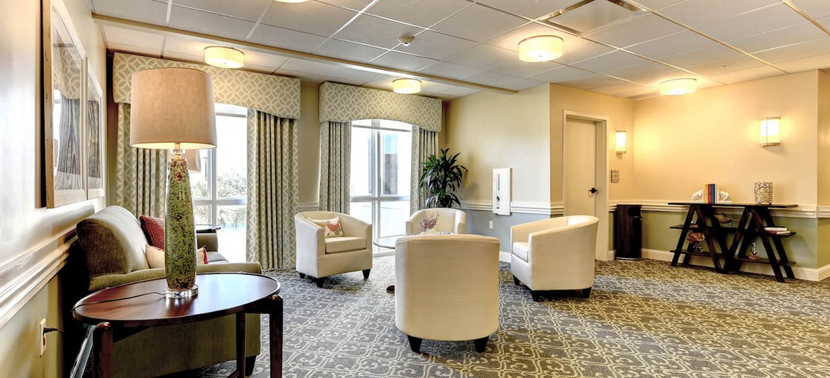 A well-lit lobby with comfortable seating and large windows.