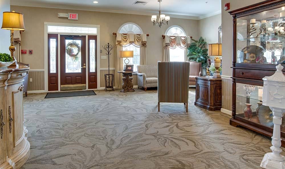 A well-decorated lobby area with furniture and ambient lighting.