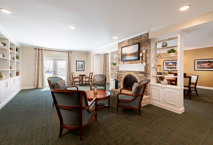 A cozy living room with a fireplace and comfortable seating.