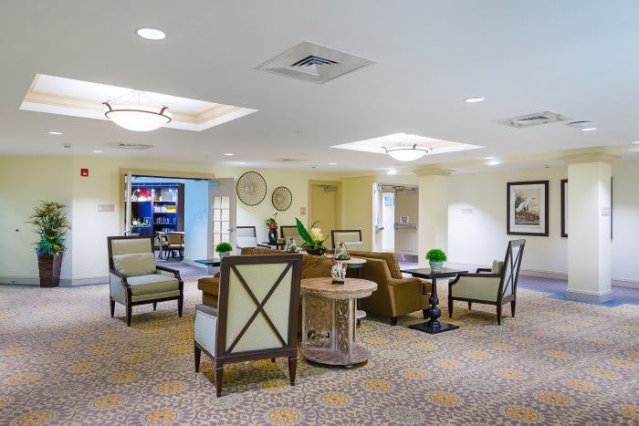 A well-decorated lounge area with comfortable seating and soft lighting.