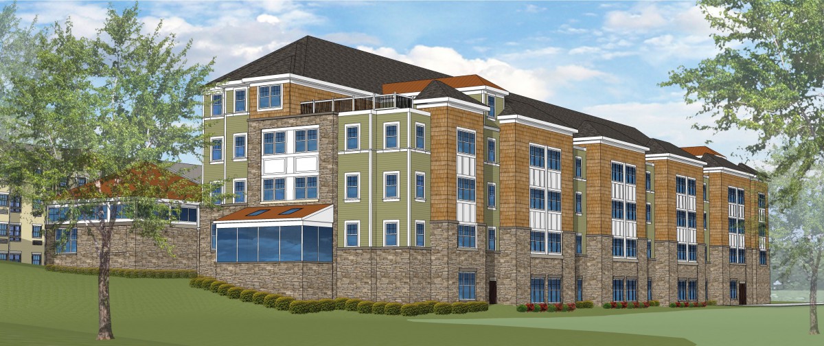 A modern multi-story residential building with a combination of brick and colored siding.