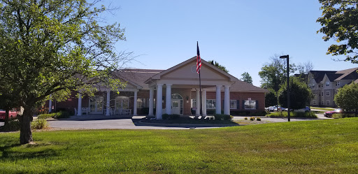 A welcoming entrance to a community building with a flag proudly displayed.