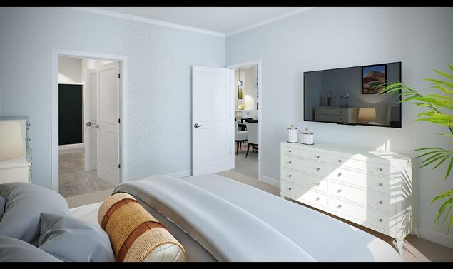A modern, minimalist bedroom with light-colored walls, featuring a bed, a dresser, and a wall-mounted TV.