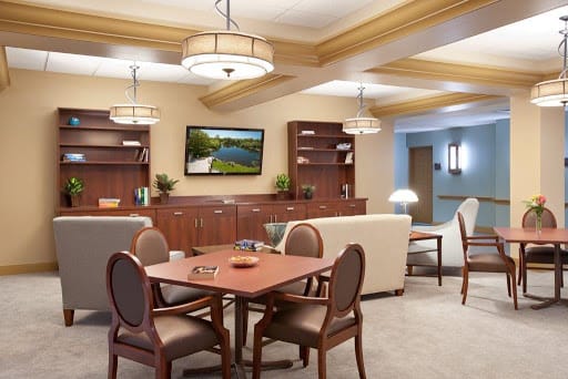 A cozy living room with comfortable seating, a TV, and modern decor.