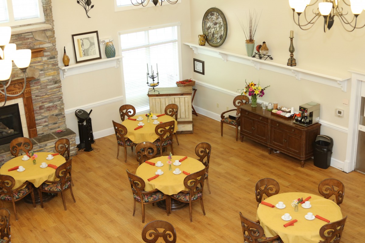 A cozy dining room with beautifully arranged tables and elegant decor.
