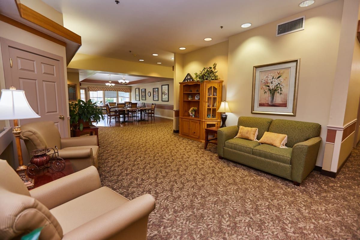 A cozy living room with comfortable seating and warm lighting.