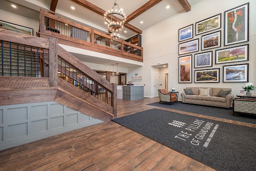 A welcoming hotel lobby featuring elegant wooden architecture and contemporary art.