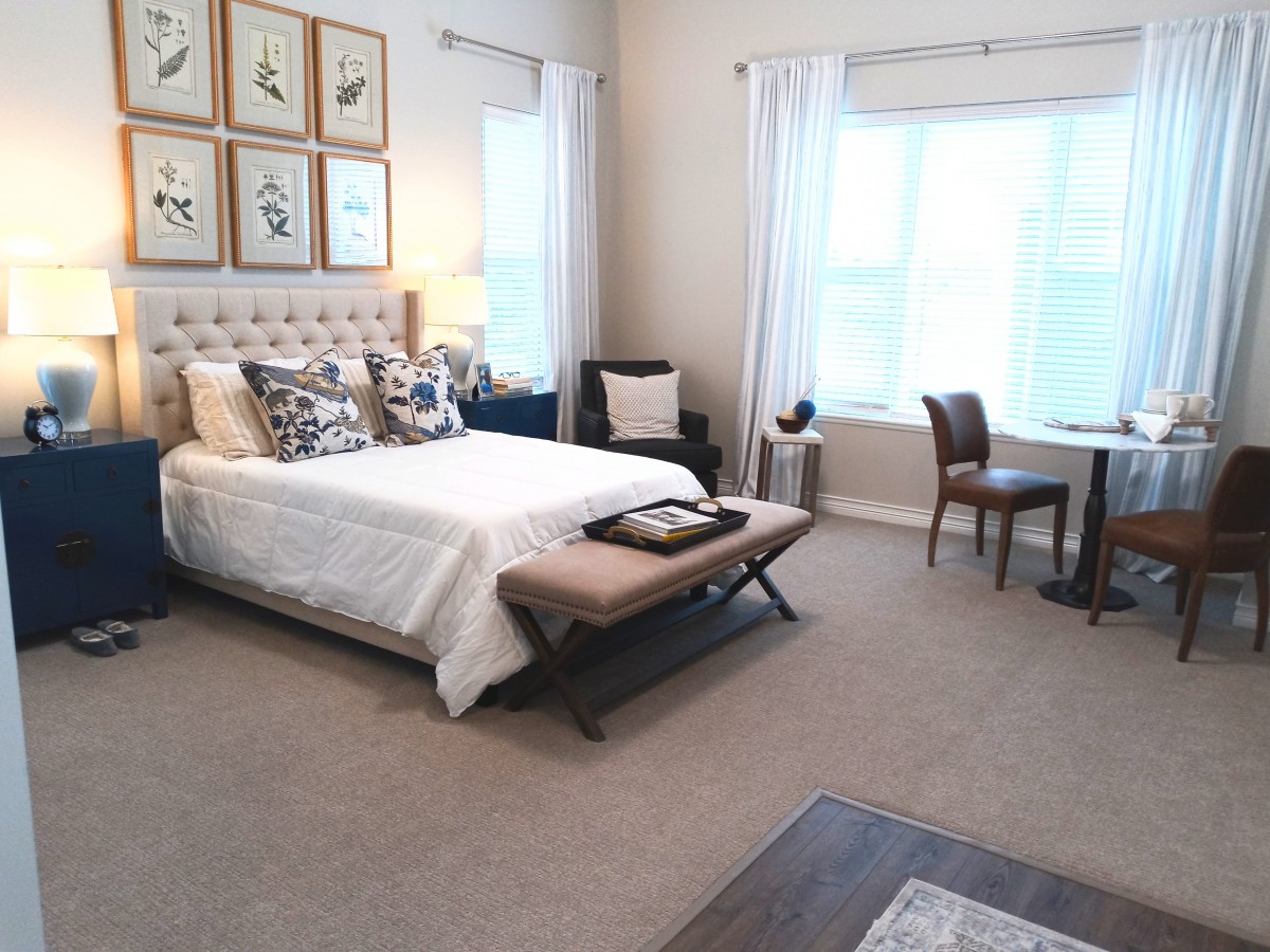 A modern bedroom with elegant decor and a cozy atmosphere.