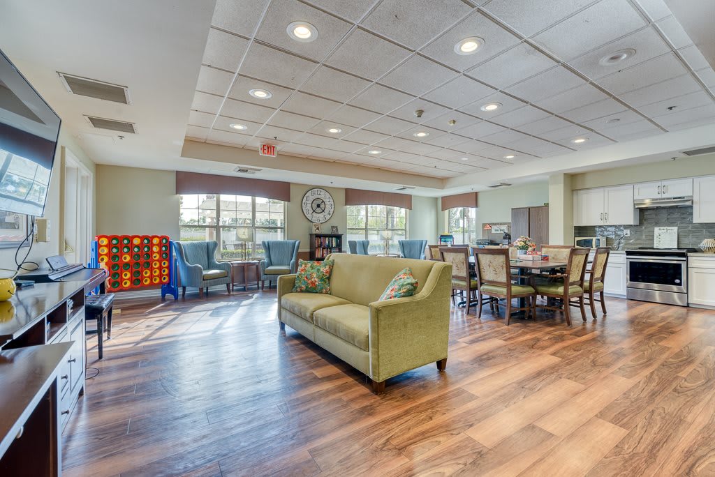A spacious and modern living room area with ample seating and natural light.