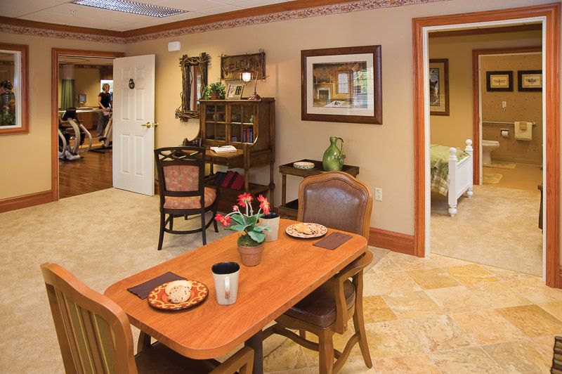 A cozy dining area with elegantly set tables and warm decor.